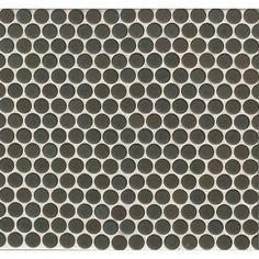 a black and white tile with circles on it