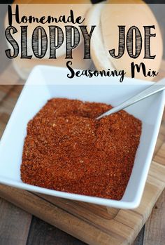 homemade sloppy joe seasoning mix in a white bowl on a wooden cutting board with text overlay