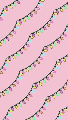 a string of christmas lights on a pink background seamless wallpaper with many colors