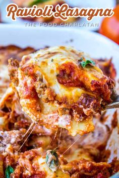 ravioli lasagna the food charlatan is being lifted from a casserole dish