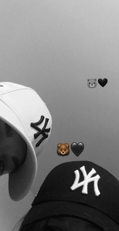 a person wearing a new york yankees hat with hearts and teddy bears in the background