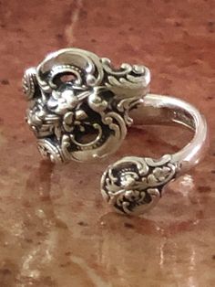 Vintage sterling silver spoon ring from a Wallace Co. sterling spoon.  Lovely classic detailed pattern.  Authentic vintage spoon ring of solid sterling.  Sizes 7.5 and 8.5.  There is some adjustment possible.  Please message for info on adjustment. I sell vintage items but do not list anything (knowingly) that is overly worn or damaged.  Happy customers are important to me so please contact me with any issues that might come up with your order. Shipping overages for combined orders will be refun Vintage Spoon Jewelry, Vintage Spoon Rings, Sterling Silver Spoon Ring, Silver Spoon Ring, Sterling Silver Spoons, Vintage Spoons, Spoon Ring, Spoon Jewelry, Spoon Rings