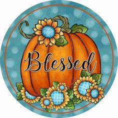 a pumpkin with sunflowers on it and the word, blessed