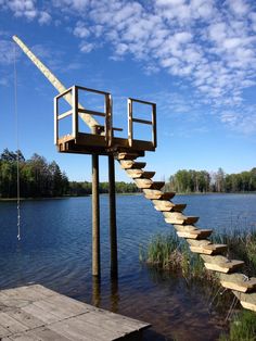 there is a wooden staircase going up to the water's edge with no people on it