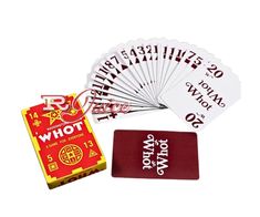 a set of four playing cards and a red book with white writing on the front