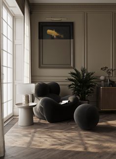 a living room filled with furniture and a potted plant in the middle of it