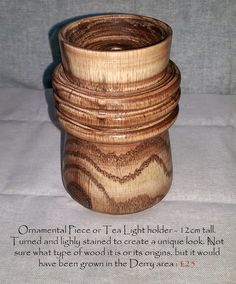 a stack of wooden bowls sitting on top of a table