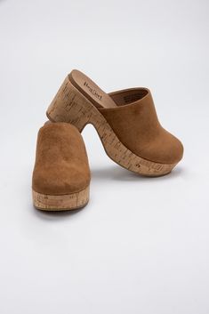 Say hello to ultimate comfort and style with Corky's Watch Your Back Heeled Mule. Featuring a rounded toe, faux suede upper, and plenty of smoosh, these mules will have you looking and feeling your best. Don't be caught without them! Heel Height: 3.5" Platform Height: 1" All Man Made Materials True To Size Cork-bed Midsole Mules With Round Toe, Leather Open Toe Mules With Cork-bed Midsoles, Brown Woven Leather Synthetic Mules, Brown Mules With Removable Insole, Medium Width, 70s Inspired Outfits, Brown Wedge Heel Mules With Cork-bed Midsoles, Watch Your Back, Heeled Mule, Your Back