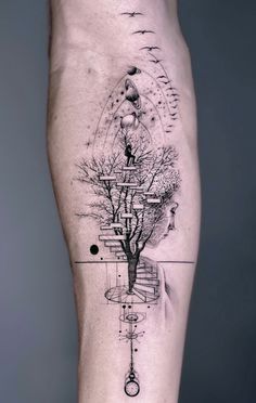 a man's leg with a tree and compass tattoo on the side of it