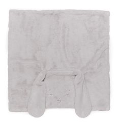 a white blanket with bunny ears on the front and back of it's head