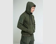 This is an example of a hooded garment, known as a "hoodie." The term is generally associated with sweatshirts, however, can essentially refer to any type of garment with a hood, though usually not with hooded jackets. Tactical Store, Half Gloves, Random Style, Mil Spec, Tactical Clothing, Green Hoodie, Baggy Fits, Hoodie Design