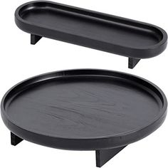 two black trays sitting on top of each other