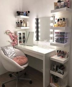 a white desk topped with a mirror next to a shelf filled with makeup and other items