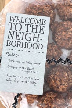 there is a bag of cookies with a sign on it that says welcome to the neighborhood