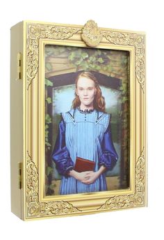 a small box with a painting of a girl holding a book in it's hands