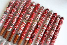 red and white sprinkled donuts are lined up in a row on top of each other