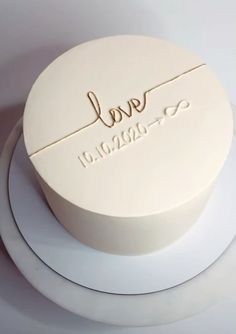 a white cake with the word love on it