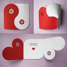 some red and white paper with hearts cut out of it on a cell phone screen