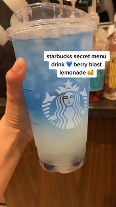 someone holding up a starbucks drink with the message starbucks's secret menu, drink berry blast lemonade