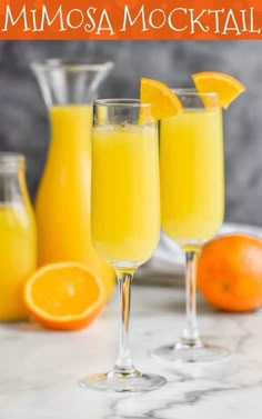 two glasses filled with orange mimosa cocktail