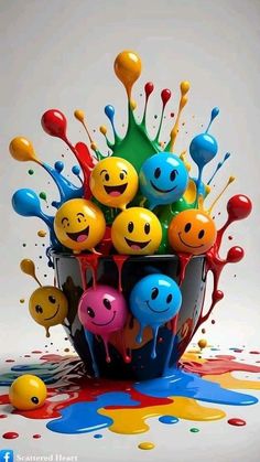 a bucket filled with lots of different colored balls and smiley faces on top of it