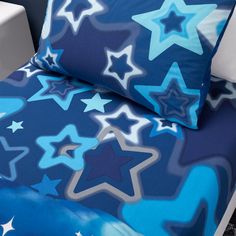 a bed with blue and white stars on it