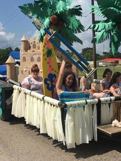 a group of people riding on the back of a truck