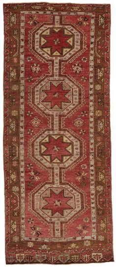 an old rug with red and beige colors on the bottom, surrounded by other patterns