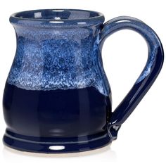 a blue and white ceramic pitcher on a white background