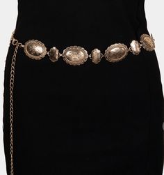 Catch the bohemian spirit and Southern California essence with our "Sunset Serenade Chain Belt." This piece is the perfect addition to take your outfit from simple to stunning with a nod to vintage charm. Fit: Adjustable chain for a customizable waist fit Style: Vintage-inspired, antique gold-tone conchos Occasion: Perfect for jazzing up a casual day look or adding flair to evening attire Styling Suggestions: Layer over a flowing maxi dress or cinch a billowy blouse for an effortlessly chic silh