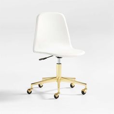 a white office chair with gold wheels on an isolated background, viewed from the front