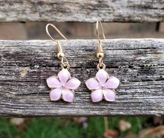 These cute little Sakura flower (cherry blossom) earrings would make a great gift. You can choose your color: white, pink, lavender, or turquoise. The flowers measure 1/2 inch wide. The hooks are nickel-free. This would make a great gift for a bridesmaid or a birthday, an anniversary or Christmas. All jewelry items come in a gift box. Follow this link for a matching necklace... https://www.etsy.com/listing/758932422/sakura-necklace-cherry-blossom-necklace?ref=listings_manager_grid Pink Birth Flower Earrings For Wedding, Cute Flower Earrings For Mother's Day Gift, Cute Flower Charm Earrings For Gift, Cute Flower Charm Earrings As Gift, Flower Shaped Earrings For Bridesmaids, Blossom Flower Earrings For Gift, Blossom Color Flower Earrings For Gift, Cute Gold Flower Earrings For Gift, Cute Flower-shaped Earrings For Wedding