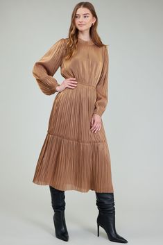 Done in a burnished gold shade, this long-sleeve midi dress captivates with its slight sheen and subtly sheer pleats. Ruffle trim and tie detailing accent the split neckline, while the elasticized waist draws in the shape. •hook-and-eye closure •Pleated at front •Pleated •Standard: 48" L Item number 2490164 100% Polyester Gentle cycle cold Taylor Swift Dress, Pleated Midi Dress, Print Trends, Vacation Dresses, Long Sleeve Midi, Sweater Sale, Long Sleeve Midi Dress, Trending Dresses, Long Sweaters