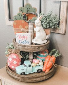 an easter basket with eggs, carrots and bunny figurines on top of it