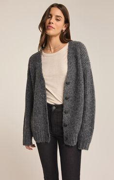 Experience ultimate coziness with this heathered, relaxed cardigan crafted from our soft and chunky sweater yarns. Featuring faux horn buttons for versatile styling and rib cuffs, it effortlessly elevates any outfit, whether worn open or closed. Maxi Jumpsuit, Quilted Puffer Vest, Cozy Cardigan, Car Coat, Neck Piece, Graphic Tops, Favorite Sweater, Chunky Sweater, Fitted Sweater