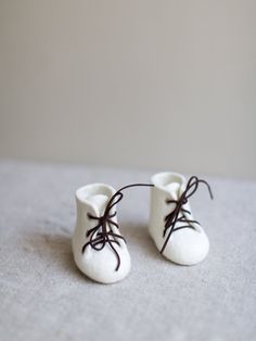 Nice idea for baby shower gift - beautiful baby booties in pure natural ivory white. Made without any seams from eco friendly organic 100% Merino wool using just water and olive oil soap. Such natural wool booties is a perfect way to share the news with your loved ones. They are perfect for baby shower gift, a great gift for a just born baby, can be used for taking special photos, perfect for Christening. Felted baby shoes are very suitable for babies as they are made of natural soft wool that l Gift Rubber Sole Round Toe Booties, Gift Booties With Rubber Sole And Round Toe, Comfortable White Closed Toe Booties, White Lace-up Booties With Soft Sole, Comfortable White Winter Booties, Comfortable Round Toe Booties As Gift, White Booties As Winter Gift, Handmade White Closed Toe Booties, White Winter Booties As A Gift