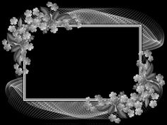 an artistic black and white photo frame with flowers on the edges, in front of a dark background