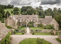 an aerial view of a large house in the countryside