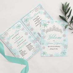 two wedding programs with green ribbons and flowers