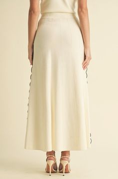 Transform your wardrobe with the Tory Pleated Skirt. This stunning white maxi skirt boasts a scalloped edge on the pleats and a banded waist, exuding pure elegance and luxury. Elevate your style with this timeless piece that promises to make you feel effortlessly chic. White Maxi Length Bottoms For Spring, Cream Relaxed Midi Maxi Skirt, White Maxi Length Lined Bottoms, Relaxed Cream Midi Length Maxi Skirt, White Maxi Length Bottoms With Lined Skirt, Relaxed Fit Cream Midi Maxi Skirt, Chic White Maxi Skirt With Elastic Waistband, White Fitted Maxi Skirt With Elastic Waistband, Elegant White Ruffled Maxi Skirt