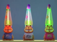 three cartoon characters with different colored lights on their heads and hands, one wearing a t - shirt that says well doh