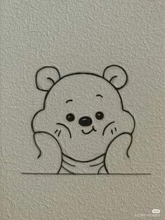 a drawing of a teddy bear on the wall