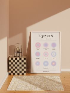 an aquarius poster next to a checkered box and lamp on a wooden floor