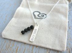 Bring your favorite essential oil with you wherever you go with our custom Lava Bead Essential Oil Necklace. Your oil aroma will last anywhere from a few hours to about a day depending on reapplication. Simple yet intricate, the tiny rough surface of the lava bead is perfect for any occasion. This necklace also features a fully custom 1" Sterling Silver textured bar which can display any word or letter of your choice. Great for personalization or gentle positive reminders throughout the day to g Minimalist 8mm Beads Necklace As Gift, Shelter Island Ny, Positive Reminders, Essential Oil Necklace, Family Harmony, Essential Oil Necklaces, Lava Bead Bracelet, Oil Diffuser Necklace, Shelter Island