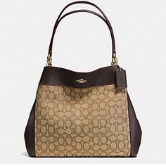 Coach Lexy Shoulder Bag In Signature Expresso Brown & Khaki Jacquard Description Never Use . New With Out Tag Perfect Shape From Smoke Free Home Same Day Shipping Coach Lexy Shoulder Bag In Signature Expresso Brown & Khaki Jacquard Signature Jacquard And Smooth Leather Inside Zip, Cell Phone And Multifunction Pockets Outline Signature Color: Khaki/Brown Gold Hardware Jacquard & Smooth Leather Magnetic Snap Closure Dark Brown Fabric Lining Center Zip Compartment Center Zip Compartment Fabric Lining Handles With 9 1/2" Drop 13" (L) 10 3/4" (H) 5" (W) Style No. F27579 Excellent Condition. Top Handle Monogram Canvas Shoulder Bag, Monogram Canvas Top Handle Shoulder Bag, Monogram Canvas Satchel With Double Handle, Bags With Gold-tone Hardware And Monogram Canvas, Elegant Coated Canvas Satchel For Errands, Elegant Coated Canvas Bags, Elegant Coach Coated Canvas Bags, Favorite Handbags, Brown Leather Bag