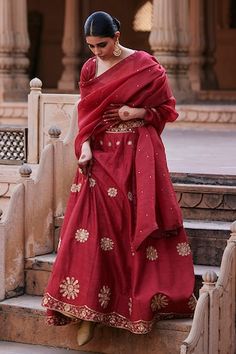 Vermillion red flared raw silk lehenga with edelweiss bloom motif zardozi embroidery. Paired with a half sleeves pure silk sweetheart neck blouse with floral motif buta zardozi embroidery and organza dupatta adorned with spluttered zardozi accents. - Aza Fashions Red Slub Silk Sets For Festivals, Wedding Slub Silk Lehenga For Navratri, Festive Slub Silk Wedding Sets, Festive Wedding Slub Silk Sets, Slub Silk Lehenga For Diwali, Red Slub Silk Traditional Wear For Wedding, Wedding Choli In Fitted Slub Silk, Festive Slub Silk Lehenga For Diwali, Festive Fitted Lehenga In Slub Silk