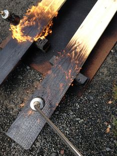 a piece of metal with fire coming out of it