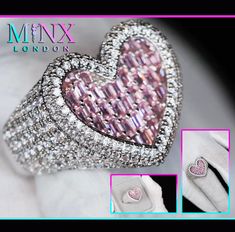 a pink heart shaped ring with diamonds on it's sides and the words mmrx london written below