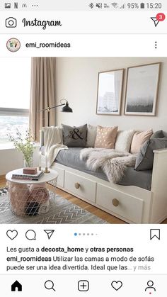 an instagramted photo of a living room with grey couches and white coffee table