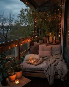 a balcony with lights and pillows on it